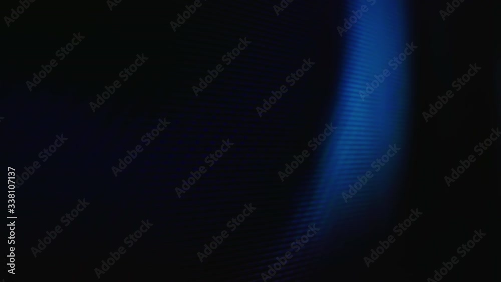 Macro view: bright colorful pixels on LCD red screen of modern TV with playing movie in light room extreme close view