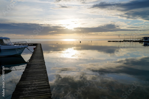 pontoon pier in yellow night sunset in lake of biscarrosse in landes france