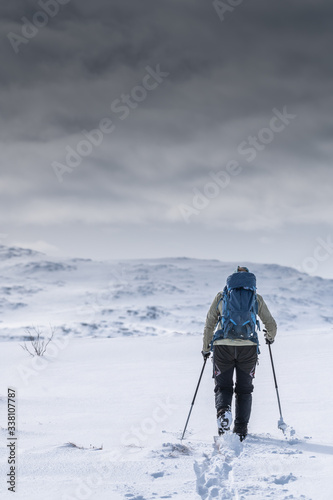 Woman skiing in a winter lanscape in Norway