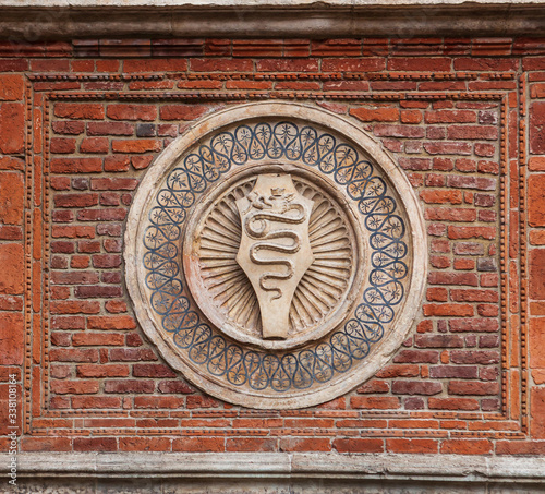 Coat of arms of the House of Visconti on the wall of church Santa Maria delle grazie photo