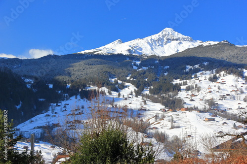 View of Bernese Alps from Grindelwald. Switzerland, Europe.Grindelwald is a village and municipality in the Interlaken-Oberhasli administrative district in the canton of Berne in Switzerland.