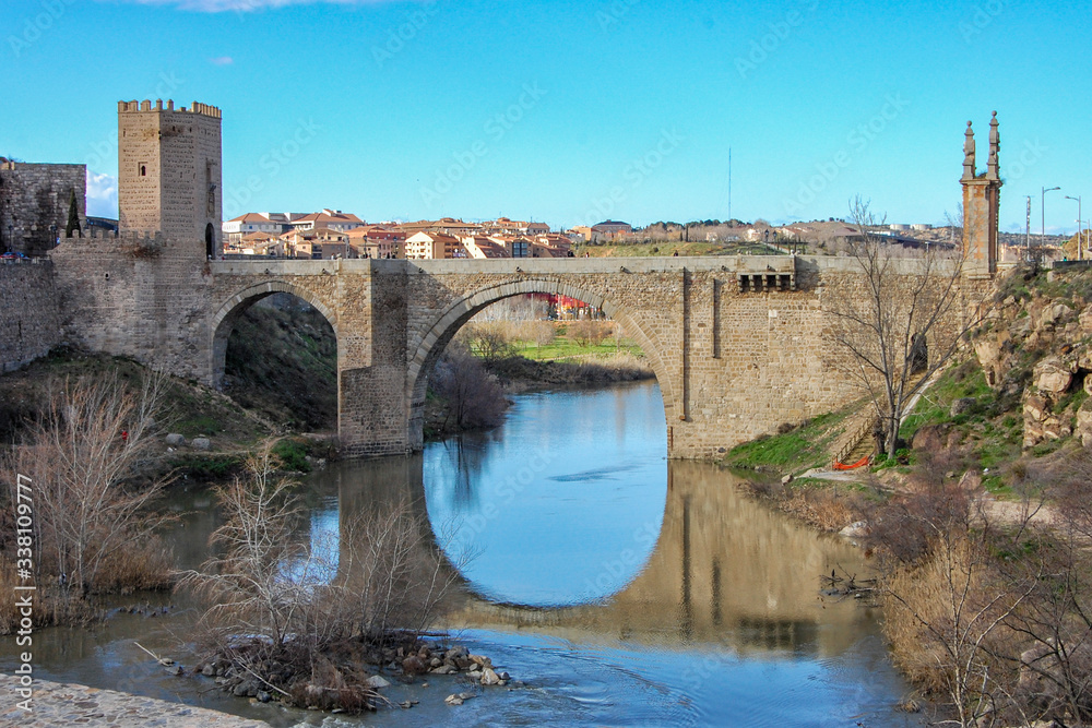 Medieval Alcantara bridge in Toledo. Castilla la Mancha. Spain Medieval Alcantara bridge in Toledo. Castilla la Mancha. Spain