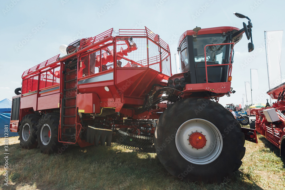 Fototapeta premium red sugar beet harvester at summer exhibition