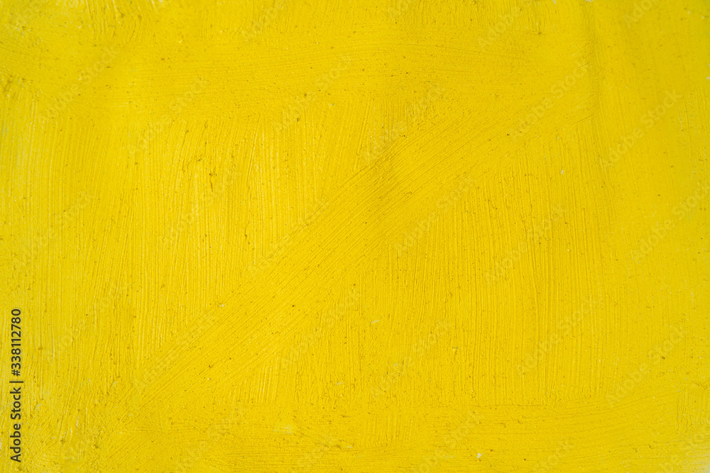 A beautiful Yellow paint texture on wall, background - Image. Color paint strokes.