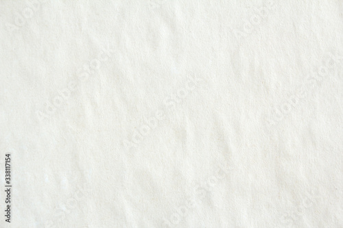 Old crumpled white sheet of paper with rough surface texture background.