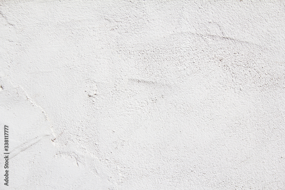 White plaster painted wall with rough grungy surface texture background
