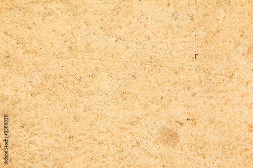 Old brown beige shabby wall texture background. Copy space for text.