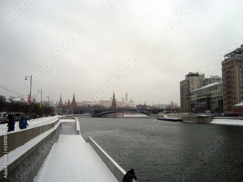 Bridge over the Moskva river. View of the Moscow Kremlin on a cloudy wet winter day.
