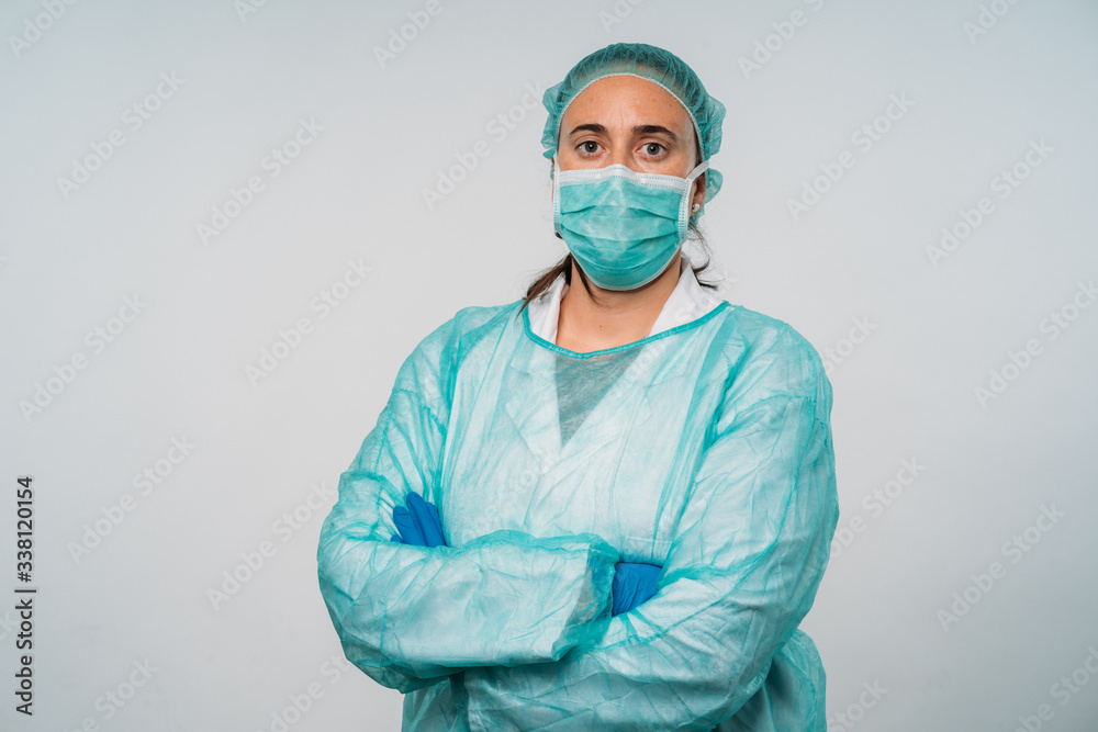 COVID-19 Coronavirus pandemic happy doctor positive with hope wearing surgical mask and protective scrubs at hospital. Inspiring confidence in the future to solve the crisis. COVID-19 Coronavirus pandemic happy doctor positive with hope wearing surgical mask and protective scrubs at hospital. Inspiring confidence in the future to solve the crisis.