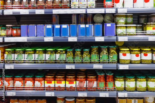 Interior view canned food products in cold storage  store.