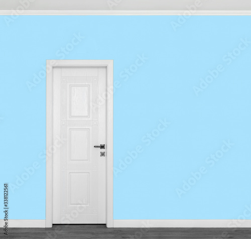 Beautiful wooden white door on empty blue wall with copy space for your text. © Loraliu