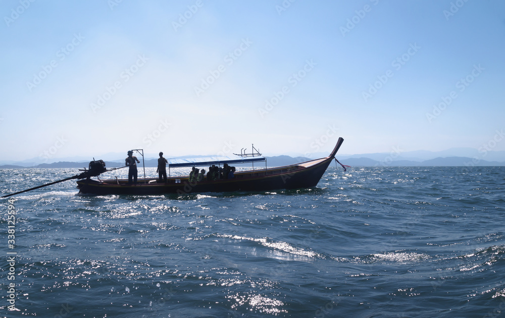 boat in the sea in the evening sunlight over beautiful sky background, luxury summer adventure, active vacation in Thailand boat in the sea in the evening sunlight over beautiful sky background, luxury summer adventure, active vacation in Thailand