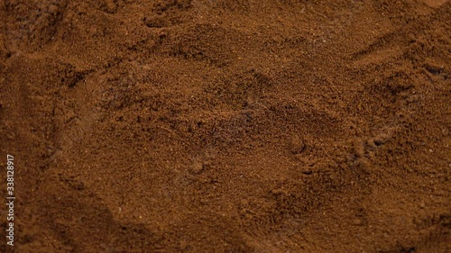 Surface of the ground coffee beans, background photo