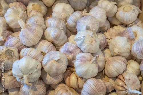 Garlic in the box. Large vegetables. Selling a crop in the market. Natural, healthy, vitamin-rich foods. Food for health.
