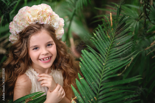 Cute girl 7 years old smiling without upper teeth. Space for text.