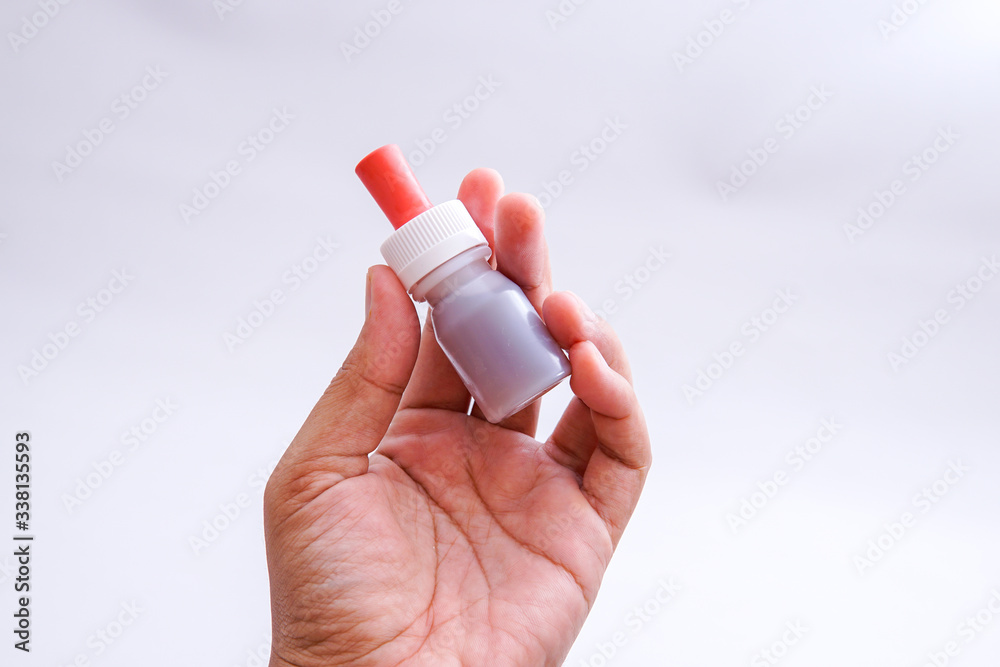 the bottle containing the vaccine in the hand the bottle containing the vaccine in the hand