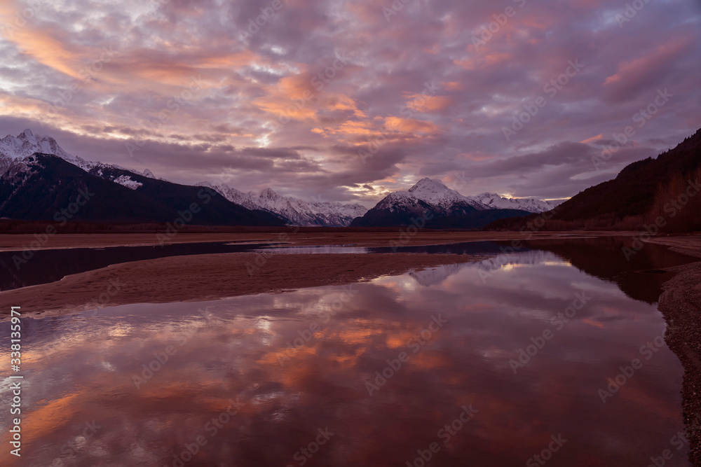 Still Waters in the Chilkat Valley - The Chilkat Mountain Range at sunset is reflected in the still pools of water in the Chilkat Valley. Haines Highway, Haines, Alaska. Still Waters in the Chilkat Valley - The Chilkat Mountain Range at sunset is reflected in the still pools of water in the Chilkat Valley. Haines Highway, Haines, Alaska.