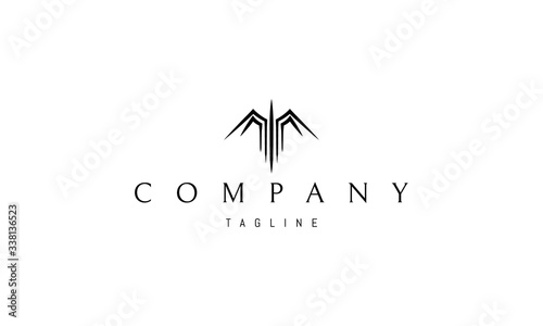 Vector logo on which the abstract image of the bird spread its wings.