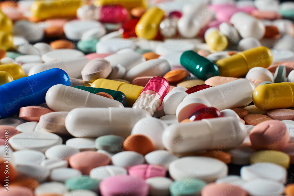 Heap of pills. Background made from colorful pills and capsules