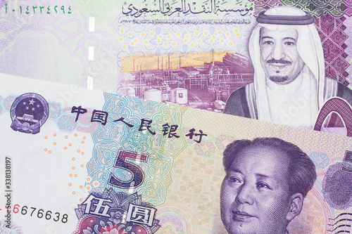 Wallpaper Mural A close up image of a five riyal note from Saudi Arabia along with a five yuan bank note from the People's Republic of China Torontodigital.ca