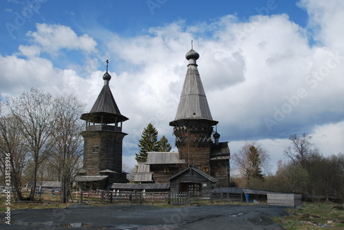 Ancient wooden church of Dmitry Solunsky Myrrh-pouring in the November cloudy evening. Village of Shcheleyki, Leningrad Region, Russia photo