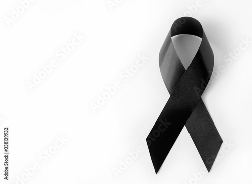 Black symbolic ribbon - Mourning and memory of events at the Virgin Polytechnic Institute. Melanoma problem. On a white background photo