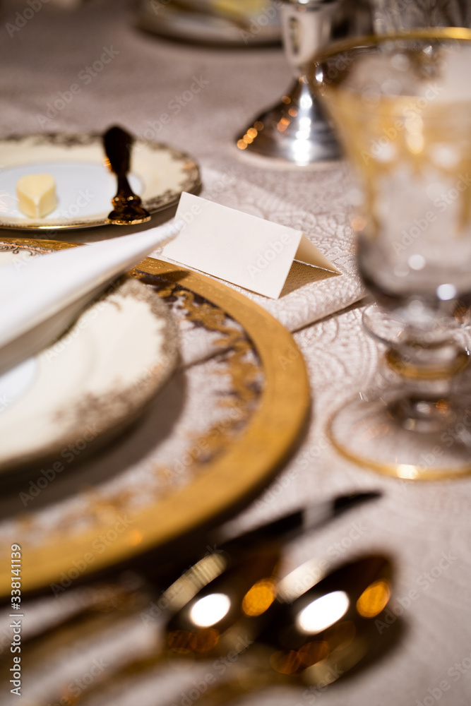 Elegany high end diner setup with golden cutlery Elegany high end diner setup with golden cutlery