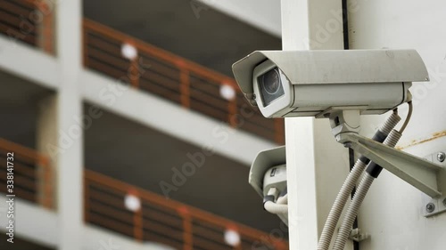 Security video camera on the street wall of office building