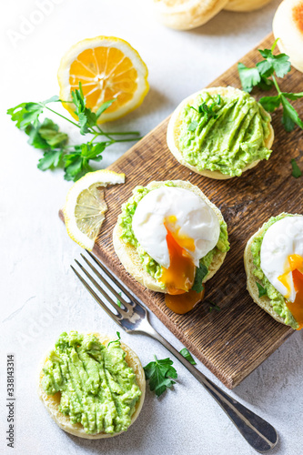 Fresh Homemade English Muffins with Avocado and Egg. Breakfast  morning concept.