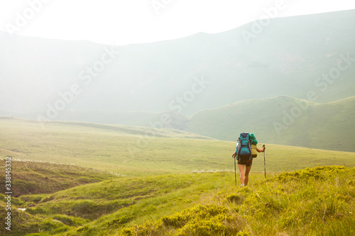 Young people are hiking in Carpathian mountains in summertime © Maygutyak