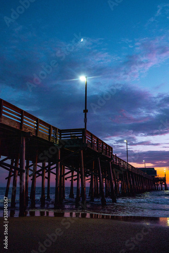 Low angle view of Newport Beach Pier during sunset