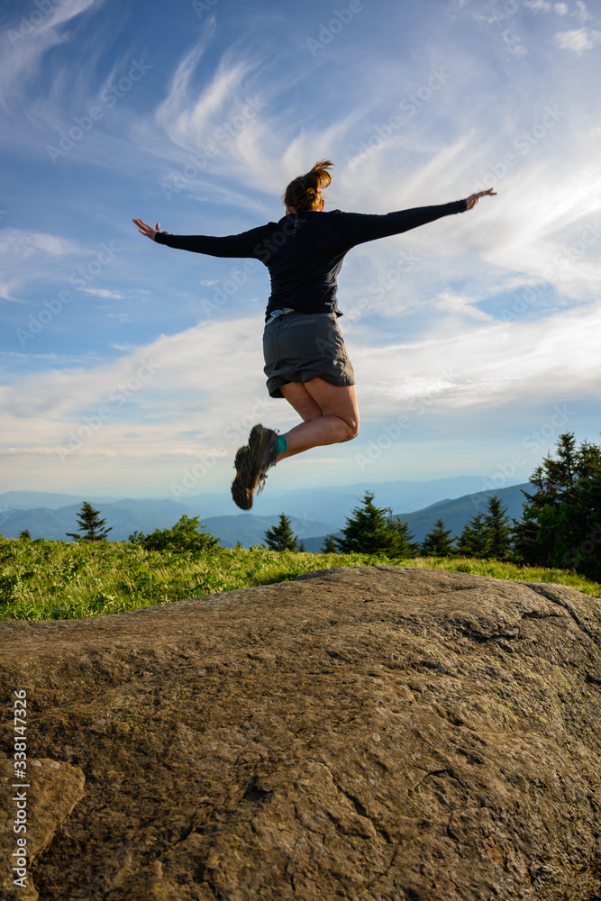 Leaping for Joy Against a Swirly Cloudy Sky Leaping for Joy Against a Swirly Cloudy Sky