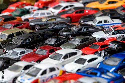 Moscow, Russia, February 2020. A mix of miniature toy cars. Lots of small toy car models, mess, top view. Background of toy cars.
