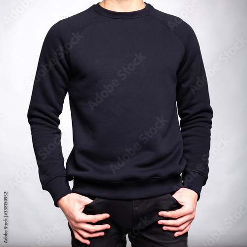 man in a black sweater with sleeves