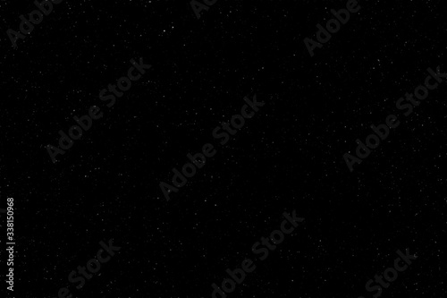 The spring dark  night sky was covered with a lot of stars with a place for the inscription. Real photo. You can use it for drawing on a material  marble tiles  or texture.