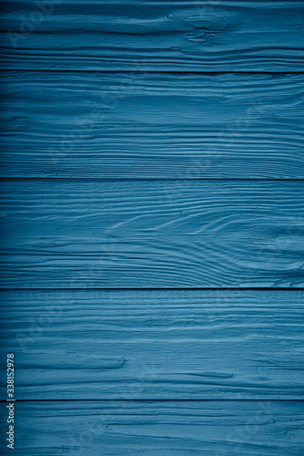 Old painted board. Blue abstract background, rough wood texture. Wall-paper