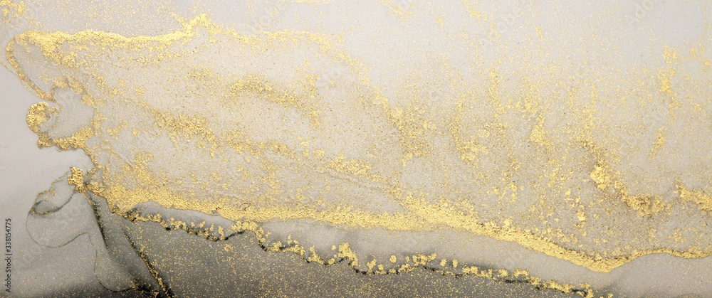 Abstract paint gold and black blots horizontal background. Alcohol ink colors. Marble texture.
