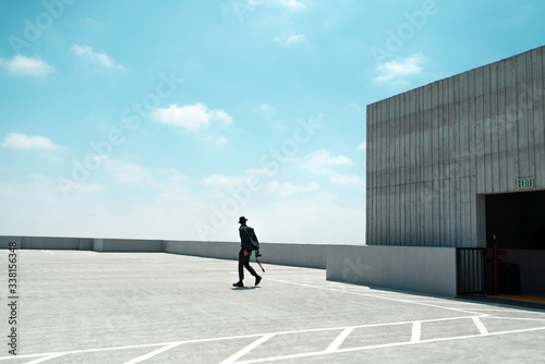 Man walking on rooftop of parking garage