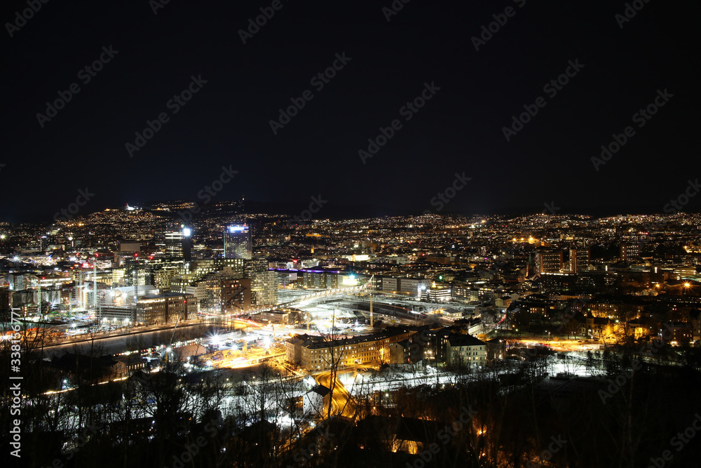 Oslo Norway Scandinavia, dark night sky aerial view on city skyline panorama, modern office building area of Oslo from as seen from Ekebergparken, long exposure photography