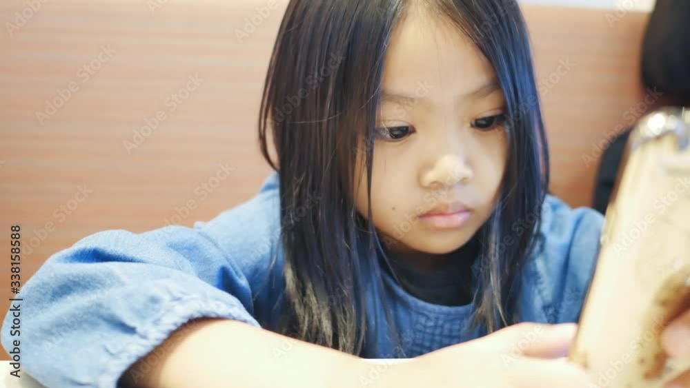 Asian Children and sister to play smartphone Asian Children and sister to play smartphone