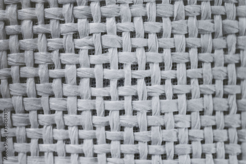 Close up sackcloth background. the weave texture of a rough sacking of white color