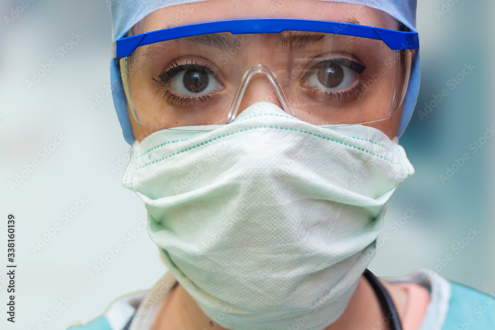 woman with protective glasses and medical mask focus on eyes