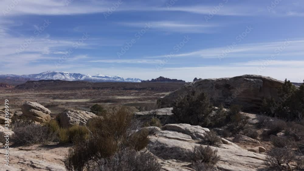 A wide timelapse shot of Arches National Park on a winter afternoon as clouds flow over. A wide timelapse shot of Arches National Park on a winter afternoon as clouds flow over.