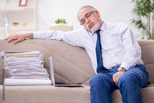 Aged businessman employee working from house