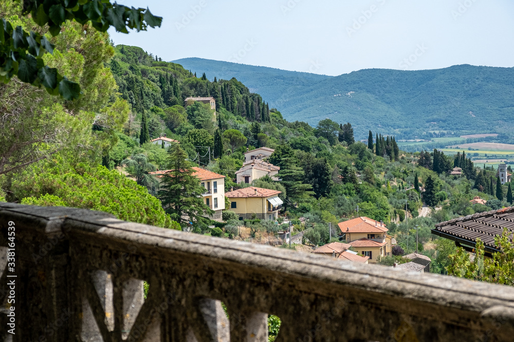 scenic Tuscan landscape from terrace in sunny summer day