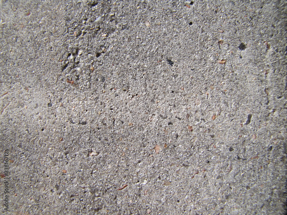 Gray rustic surface background, natural cement texture. Concrete in the sun. Gray rustic surface background, natural cement texture. Concrete in the sun.