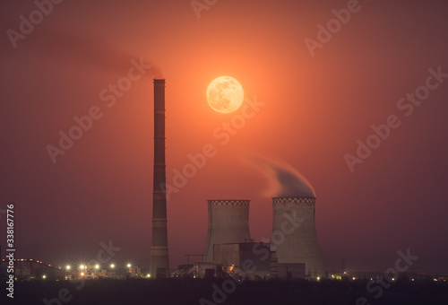 Moon rising over the nuclear power plant