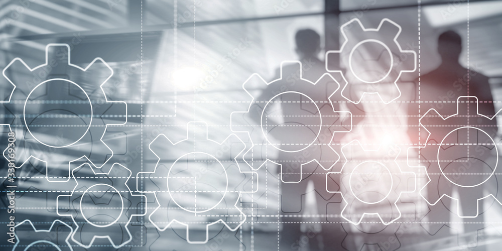 Gears mechanism on virtual screen. Business people and modern city on background. Gears mechanism on virtual screen. Business people and modern city on background.