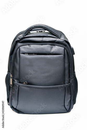 Black modern backpack with charging for phone and headphones.