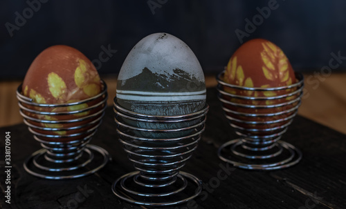 Traditional easter eggs on dark background and rustic cloth
